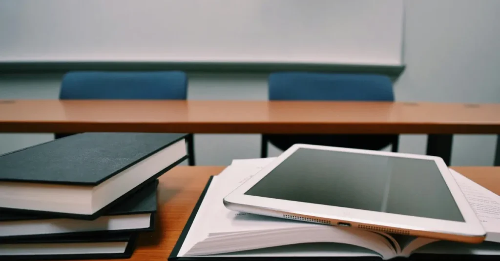 Stack of books and an ipad