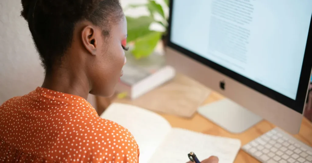 Woman writing in a notebook