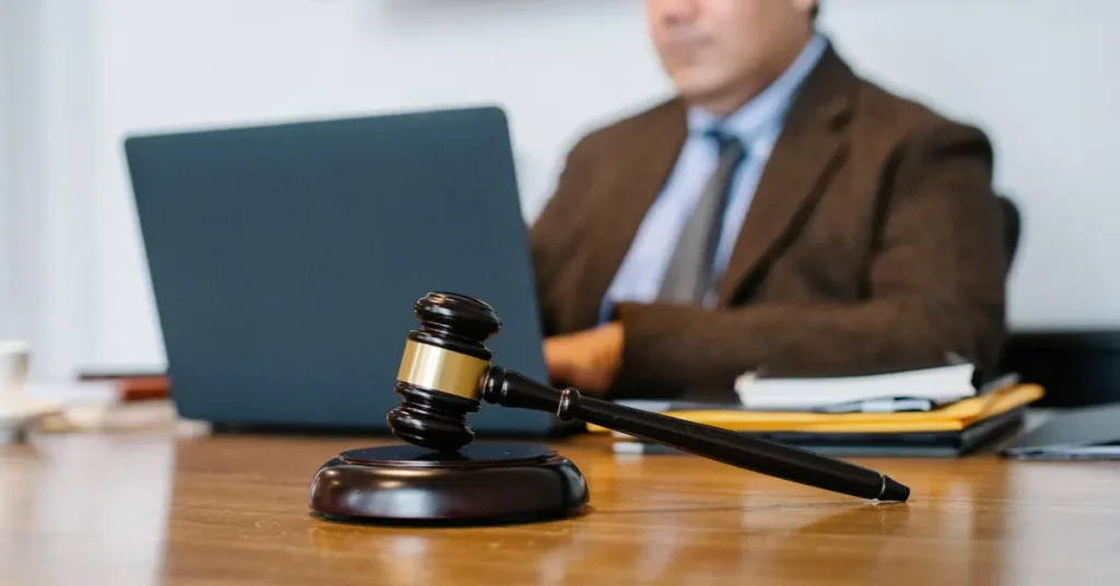 man working on a laptop in a law office